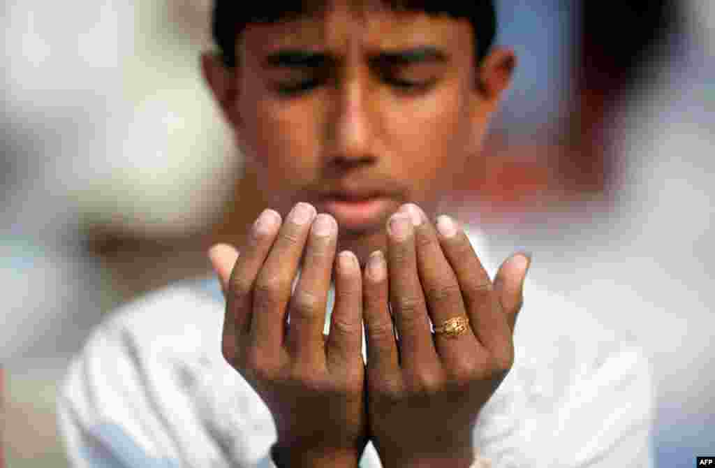 January 21: A devotee takes part in Friday prayers during Bishwa Ijtema in Dhaka. The annual three-day Bishwa Ijtema (world congregation), the second biggest gathering of Muslims after the Haj, began on Friday. (Reuters/Andrew Biraj)