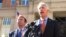 FILE - Virginia Attorney General Mark Herring, right, accompanied by Virginia Solicitor General Stuart Raphael, speaks outside the federal courthouse in Alexandria, Va., Friday, Feb. 10, 2017, following a hearing on President Donald Trump's travel ban.