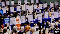 FILE - This photo taken on June 2, 2024 shows people attending a job fair in Huai'an, in eastern China's Jiangsu province.