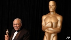 FILE - James Earl Jones poses with his honorary Oscar at the 84th Academy Awards on Sunday, Feb. 26, 2012, in Los Angeles, California (AP Photo/Chris Carlson, File)