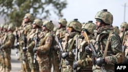 In this handout photograph taken and released by Armenian Defence Ministry on September 11, 2023, Armenian servicemen attend the opening ceremony of the Eagle Partner 2023 Armenia-US joint drills at Zar Training Center outside Ashtarak.