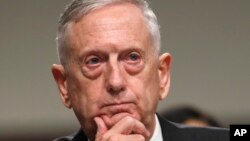 FILE - Defense Secretary Jim Mattis listens while testifying on Capitol Hill in Washington, June 13, 2017, before a Senate Armed Services Committee hearing on the Defense Department's budget. 