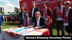 German champion football club Bayern Munich has signed an agreement to open its first soccer school in Africa, locating it in Addis Ababa, Ethiopia. European Football Federation President Esayas Jira, seated at left, and FC Bayern Munich AG executive boar