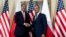 U.S. Secretary of State John Kerry (L) shakes hands as he meets with Polish Prime Minister Donald Tusk in Warsaw, Nov. 5, 2013. 