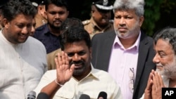 Sri Lankan President Anura Kumara Dissanayake leaves after casting his vote during the parliamentary election in Colombo, Sri Lanka, Thursday, Nov. 14, 2024.