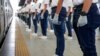 Police trainees join in a simulation exercise for proper social distancing at the LRT-2 train station in Manila, Philippines, in preparation for the possible resumption of public transportation as the community lockdown might be more relaxed next week.