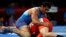 FILE - Sushil Kumar of India, left, and Adam Batirov of Bahrain, right, compete during Men's Freestyle 74 kg wrestling at the 2018 Asian Games in Jakarta, Indonesia, Aug. 19, 2018.