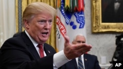 FILE - President Donald Trump speaks during a meeting in the Oval Office of the White House in Washington, Jan. 31, 2019.