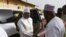 FILE - Malian Prime Minister Soumeylou Boubeye Maiga shakes hand with the Mayor of Mopti during his visit in Mali's central region on Oct. 14, 2018. 