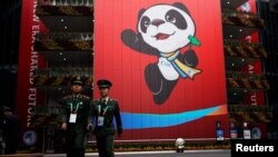 Security guards keep watch at the National Exhibition and Convention Center, the venue for the upcoming China International Import Expo, in Shanghai, Nov. 3, 2018. 