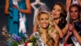 Miss Oklahoma Olivia Jordan is crowned Miss USA by Miss USA 2014 Nia Sanchez during the 2015 Miss USA pageant in Baton Rouge, Louisiana, July 12, 2015.