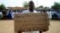 A man holds up a placard during a protest urging Mali and France to retake Kidal, Gao, May 30, 2013.