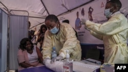 Clinicians get ready to administer mpox vaccines during the launch of the vaccination campaign at the General Hospital of Goma, Democratic Republic of Congo, on Oct. 5, 2024. 