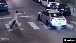 A still image from surveillance video shows a gunman approaching a Philadelphia police vehicle in which Officer Jesse Hartnett was shot shortly before midnight Jan. 7, 2016, in Philadelphia, Pennsylvania.
