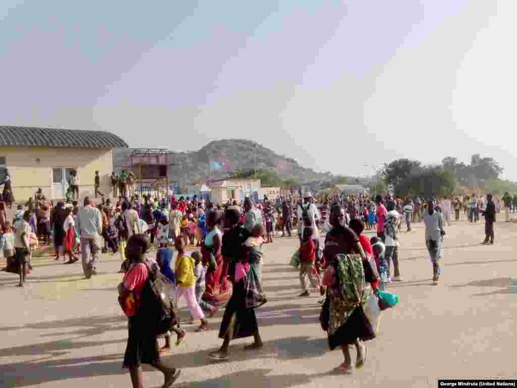 Civilians arrivie at the UN House compound in the southwestern outskirts of Juba, seeking protection from recent fighting in the capital. 