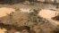 FILE- An area deforested by illegal gold mining is seen at the southern Amazon region of Madre de Dios, Jan. 25, 2014. "Human activity is leaving a pervasive and persistent signature on Earth," said a new report in the journal "Science."