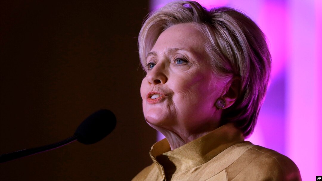FILE - Former Secretary of State Hillary Clinton speaks during a fundraising event for Big Sister Association of Greater Boston, Dec. 5, 2017, in Boston. 