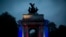 A member of the British military plays a bugle on top of the Wellington Arch before the start of two minutes of silence during a dawn service to mark the 99th Anzac Day on Hyde Park Corner in London.