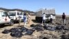 Rescuers remove body bags from the scene of an Ethiopian Airlines flight that crashed shortly after takeoff at Hejere near Bishoftu, or Debre Zeit, some 50 kilometers (31 miles) south of Addis Ababa, in Ethiopia Sunday, March 10, 2019. 