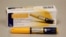 FILE - hormone injector pen