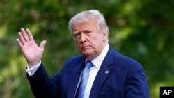 President Donald Trump walks on the South Lawn of the White House in Washington, Sunday, June 14, 2020, after stepping off Marine One as he returns from his golf club in New Jersey. 