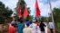 Para pengunjuk rasa membawa bendera saat mereka memprotes kudeta militer di sebuah desa di Launglon, Myanmar, 9 April 2021. (Foto: Courtesy/Dawei Watch via Reuters)
