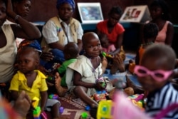 FILE - Children recovering from malnutrition play at the Children hospital in Bangui, Central African Republic.