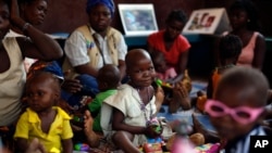 FILE - Children recovering from malnutrition play at the Children hospital in Bangui, Central African Republic.