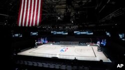 The court sits empty after a postponed NBA basketball playoff game between the Milwaukee Bucks and the Orlando Magic, Aug. 26, 2020, in Lake Buena Vista, Fla. 