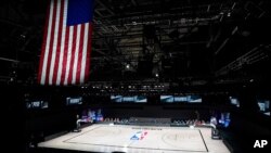 The court sits empty after a postponed NBA basketball playoff game between the Milwaukee Bucks and the Orlando Magic, Aug. 26, 2020, in Lake Buena Vista, Fla. 