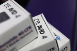 File - In this photo taken on May 14, 2018, boxes holding cell phones manufactured by ZTE are seen in a store in Miami, Florida.