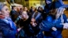 Turkish anti-riot police officers hold a protestor during a demonstration to mark the International Day for Elimination of Violence against Women in Istanbul on November 25, 2024. 