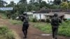 FILE - A Cameroonian policeman and a gendarme patrol in Lysoka, near Buea, in Cameroon's Anglophone South-West region, October 07, 2018.