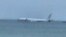 This photo provided by Diane Dircks shows a U.S. Navy plane that overshot a Marine base on Kaneohe Bay, Hawaii, Nov. 20, 2023. An official says all nine people aboard the plane have escaped injury. 