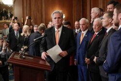 FILE - House Minority Leader Kevin McCarthy of California, center, is joined by fellow Republican lawmakers as he walks to the podium to begin speaking during a news conference on Capitol Hill in Washington, Oct. 31, 2019.