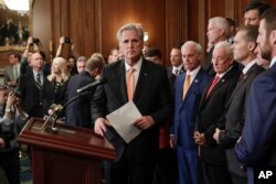 FILE - House Minority Leader Kevin McCarthy of California, center, is joined by fellow Republican lawmakers as he walks to the podium to begin speaking during a news conference on Capitol Hill in Washington, Oct. 31, 2019.