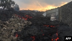 Lahar terlihat di kota Goma, pasca letusan gunung Nyiragongo di Kongo, Minggu (23/5). 