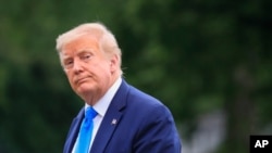 President Donald Trump walks across the South Lawn of the White House in Washington, July 11, 2020.