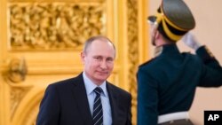 Russian President Vladimir Putin arrives to cheir a meeting of a committee on preparations for upcoming Victory Day in WWII, in Moscow's Kremlin, Russia, on April 5, 2016. 