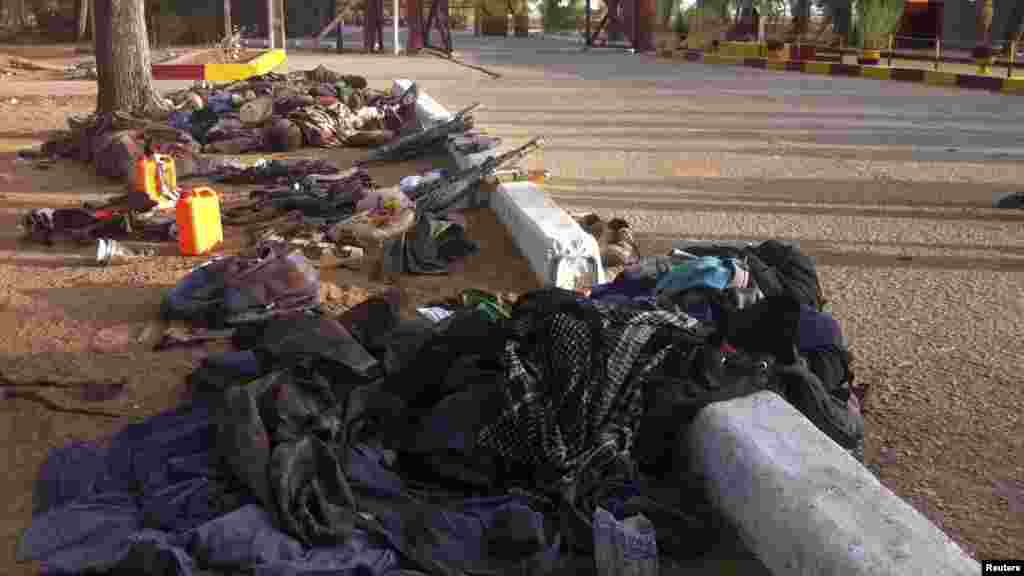 Recovered weapons, personal items and bodies of some members of the Nigerian Islamist sect Boko Haram are seen in Bama, Maiduguri, Borno State, Nigeria. May 7, 2013.