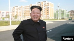 North Korean leader Kim Jong Un tours the newly built Wisong Scientists Residential District in this undated photo released by North Korea's Korean Central News Agency, in Pyongyang, Oct. 14, 2014.