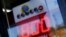 A corner store displays a Powerball lottery sign next to its cash register and checkout in Encinitas, California, Jan. 8, 2016. 
