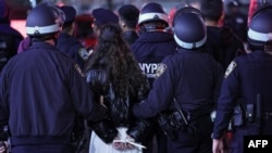 TOPSHOT - NYPD officers arrest students at Columbia University in New York City on April 30, 2024.