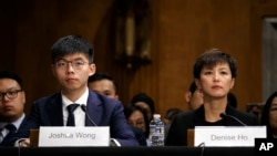  Hong Kong activists Joshua Wong, left, and Denise Ho, attend a congressional hearing about the protests in Hong Kong, Sept. 17, 2019, on Capitol Hill in Washington. 