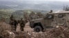 This picture taken on Oct. 13, 2024 during a controlled embed organized by the Israeli military, shows Israeli troops patrolling in the southern Lebanon's Naqoura region near the border. 