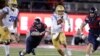 UCLA quarterback Austin Burton (12) runs during an NCAA college football game against Arizona, Sept. 28, 2019. A bill signed Monday in California will allow student athletes to use their "name, image, or likeness" to earn compensation.