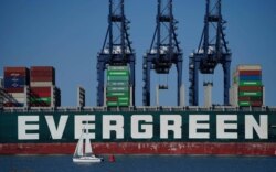 FILE - A view of the container ship Ever Given, chartered and operated by container transportation and shipping company Evergreen Marine, at the Port of Felixstowe in Suffolk, England, Aug. 3, 2021.