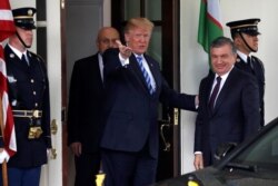 FILE - U.S. President Donald Trump greets Uzbekistan's President Shavkat Mirziyoyev at the White House in Washington, May 16, 2018.