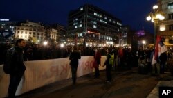 Serbia's liberal opposition supporters hold a banner that reads "against election theft" during protest in Belgrade, Serbia, Oct. 6, 2017. 