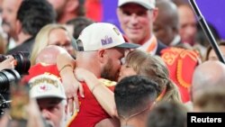 Travis Kelce kisses Taylor Swift after the Kansas City Chiefs' Super Bowl win on February 11, 2024. (Kyle Terada-USA TODAY Sports)